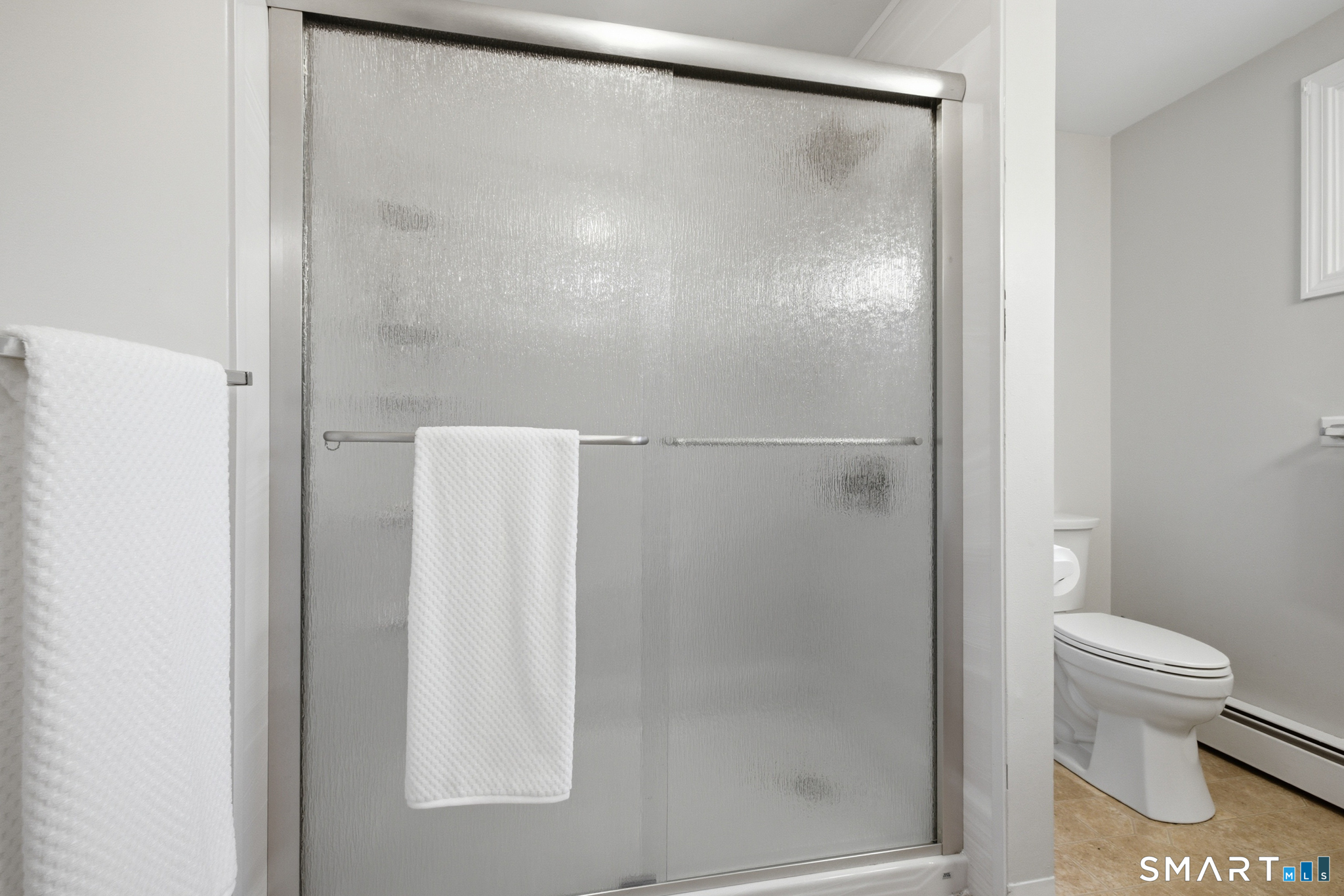 36 Grove Street, Unit E Manchester, CT 06042 - Photo 22 of 31 a bathroom with a shower and a toilet