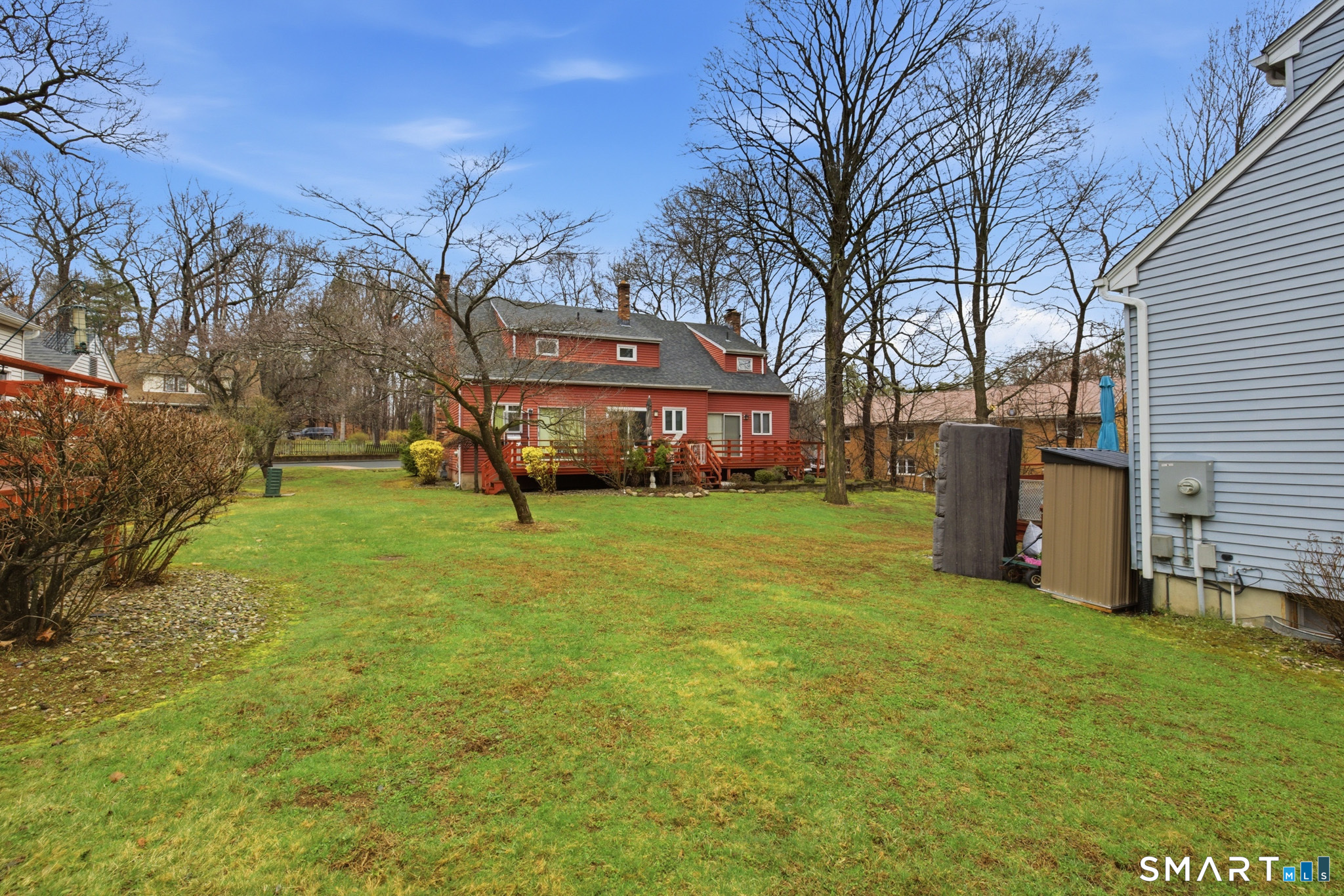 36 Grove Street, Unit E Manchester, CT 06042 - Photo 29 of 31 a view of a house with a big yard and large trees