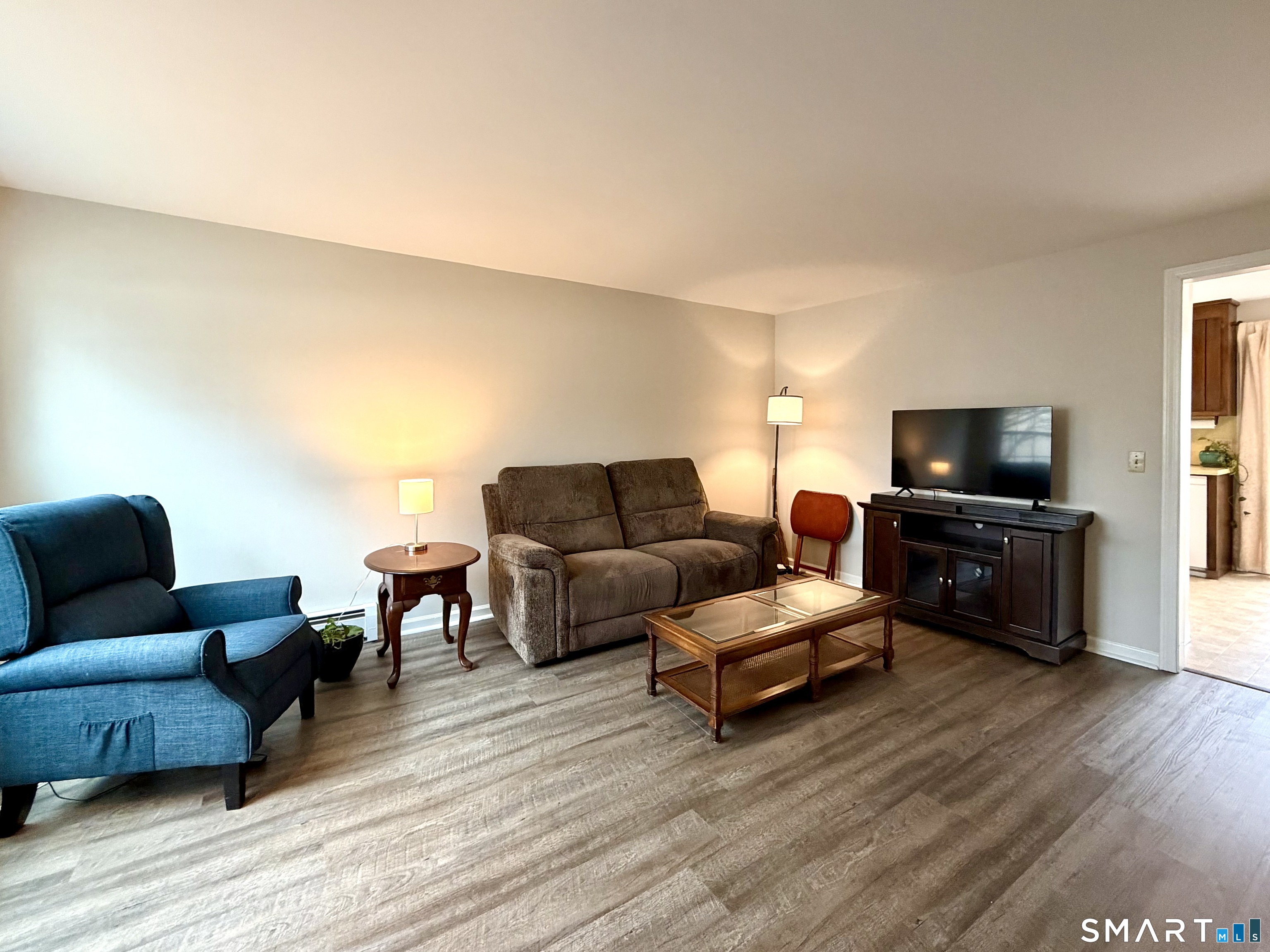 36 Grove Street, Unit E Manchester, CT 06042 - Photo 4 of 31 a living room with furniture and a flat screen tv
