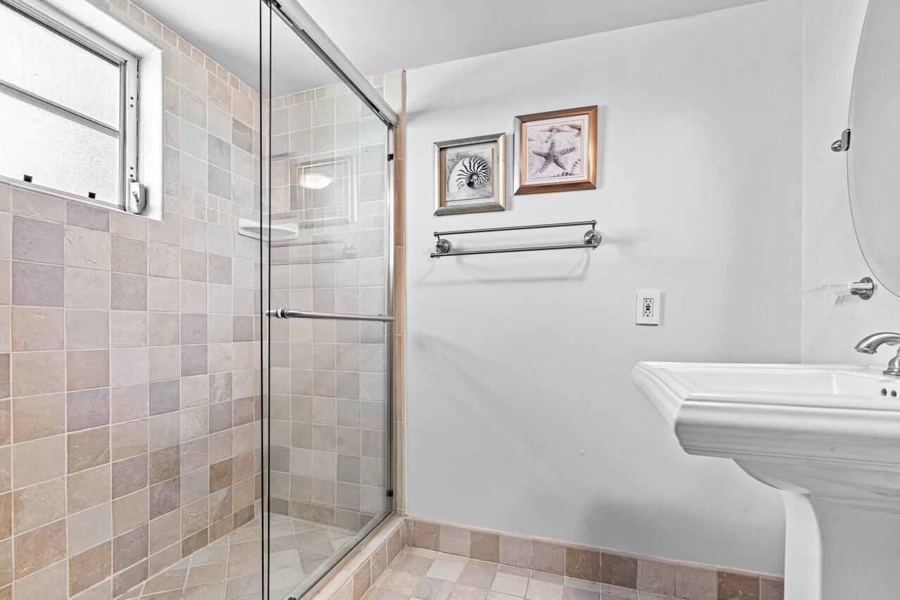 2871 North Ocean Boulevard, Unit C417 Boca Raton, FL 33431 - Photo 20 of 26 a bathroom with a shower and toilet