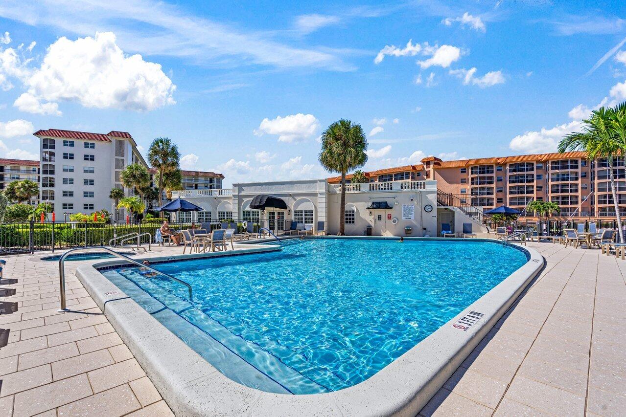 2871 North Ocean Boulevard, Unit C417 Boca Raton, FL 33431 - Photo 25 of 26 a view of a swimming pool outdoor seating