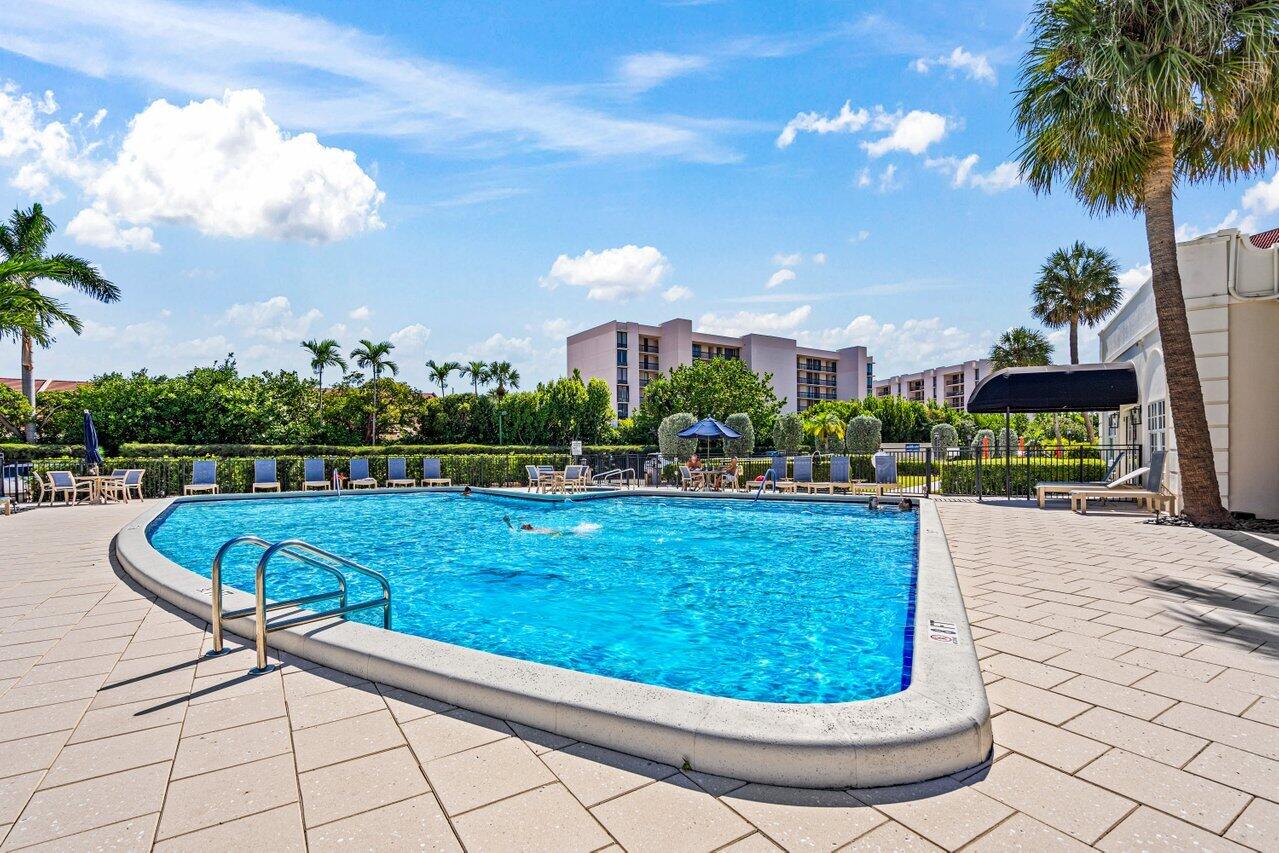 2871 North Ocean Boulevard, Unit C417 Boca Raton, FL 33431 - Photo 26 of 26 a view of a swimming pool with a patio