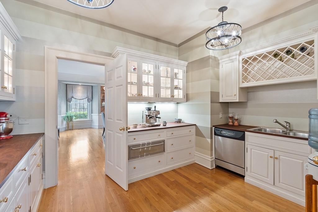 287 Westford Road Concord, MA 01742 - Photo 12 of 42 a kitchen with stainless steel appliances granite countertop a stove and cabinets