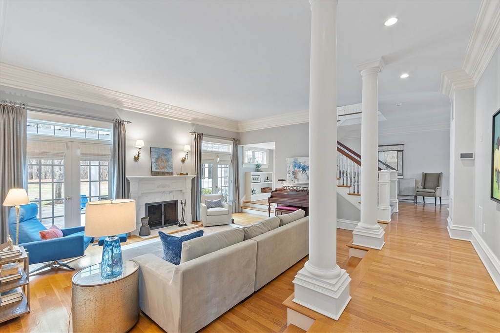 287 Westford Road Concord, MA 01742 - Photo 16 of 42 a living room with fireplace furniture and a wooden floor
