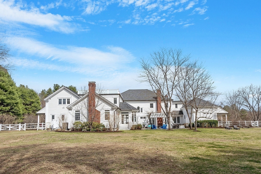 287 Westford Road Concord, MA 01742 - Photo 19 of 42 a front view of a building with a yard