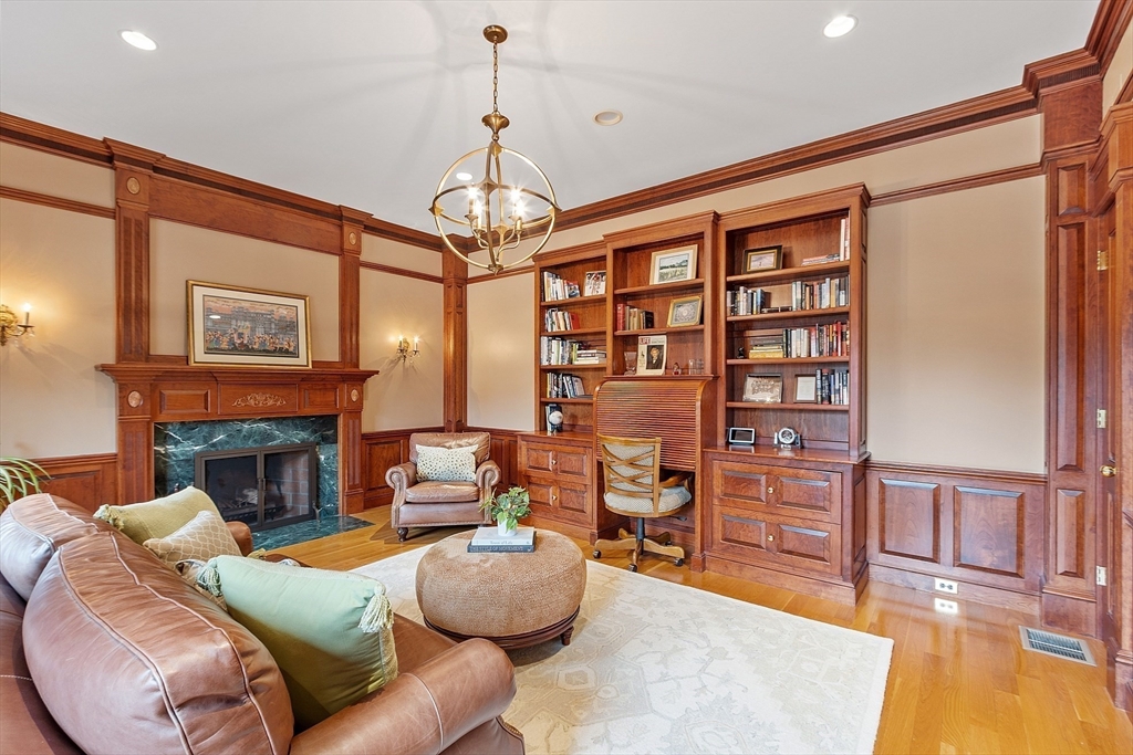 287 Westford Road Concord, MA 01742 - Photo 20 of 42 a living room with furniture a fireplace and a chandelier