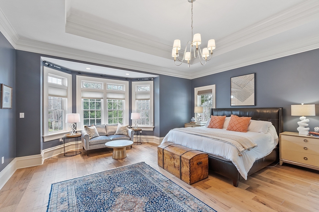 287 Westford Road Concord, MA 01742 - Photo 22 of 42 a spacious bedroom with a large bed and a couch