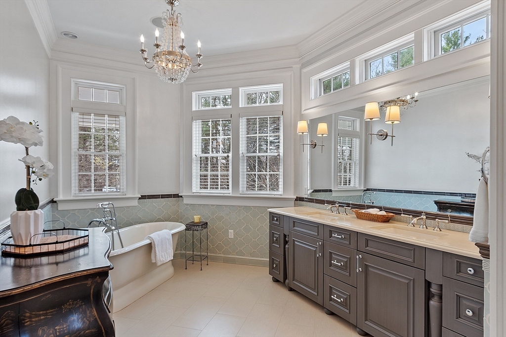 287 Westford Road Concord, MA 01742 - Photo 24 of 42 a spacious bathroom with a granite countertop sink and a mirror