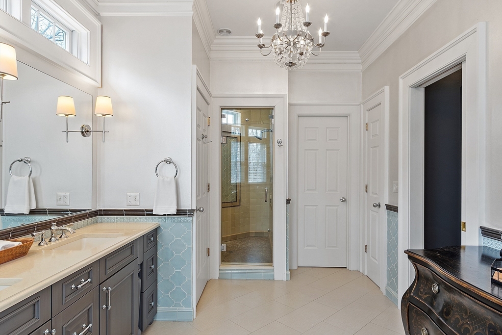 287 Westford Road Concord, MA 01742 - Photo 25 of 42 a spacious bathroom with a granite countertop sink a mirror and a shower