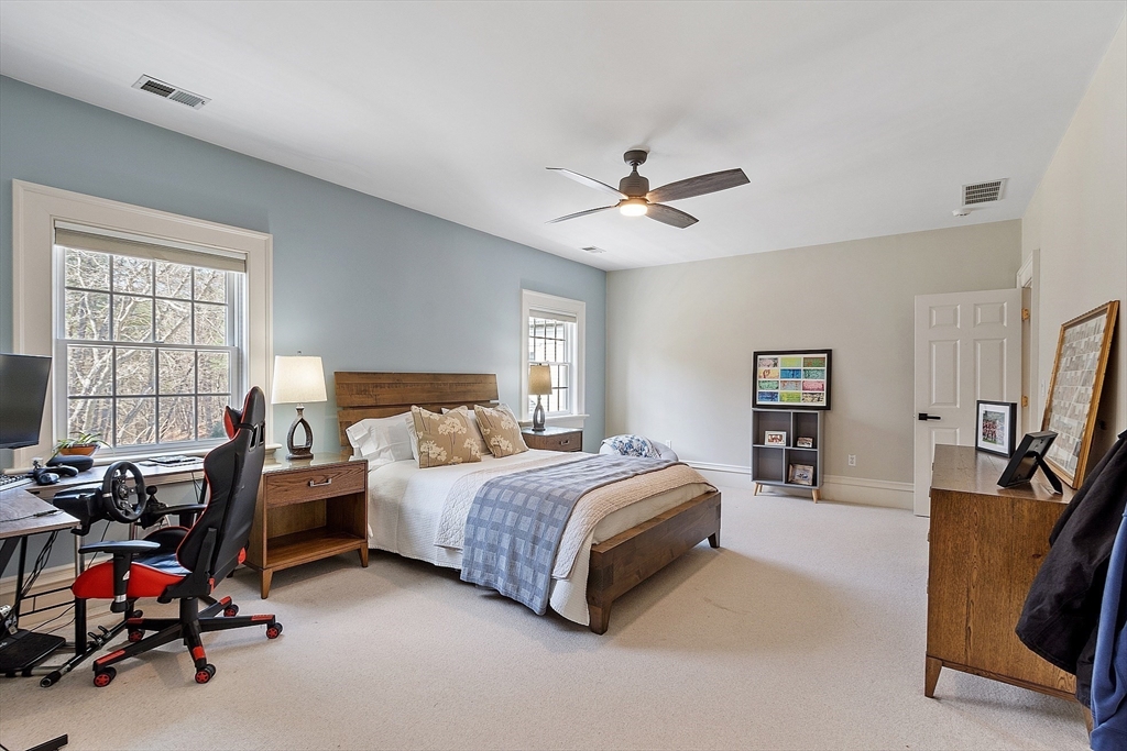287 Westford Road Concord, MA 01742 - Photo 30 of 42 a bedroom with a bed a couch and a window