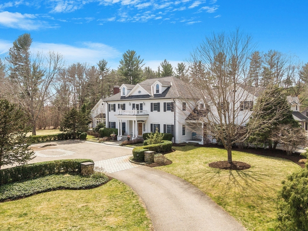 287 Westford Road Concord, MA 01742 - Photo 3 of 42 a view of a swimming pool with a house in the background