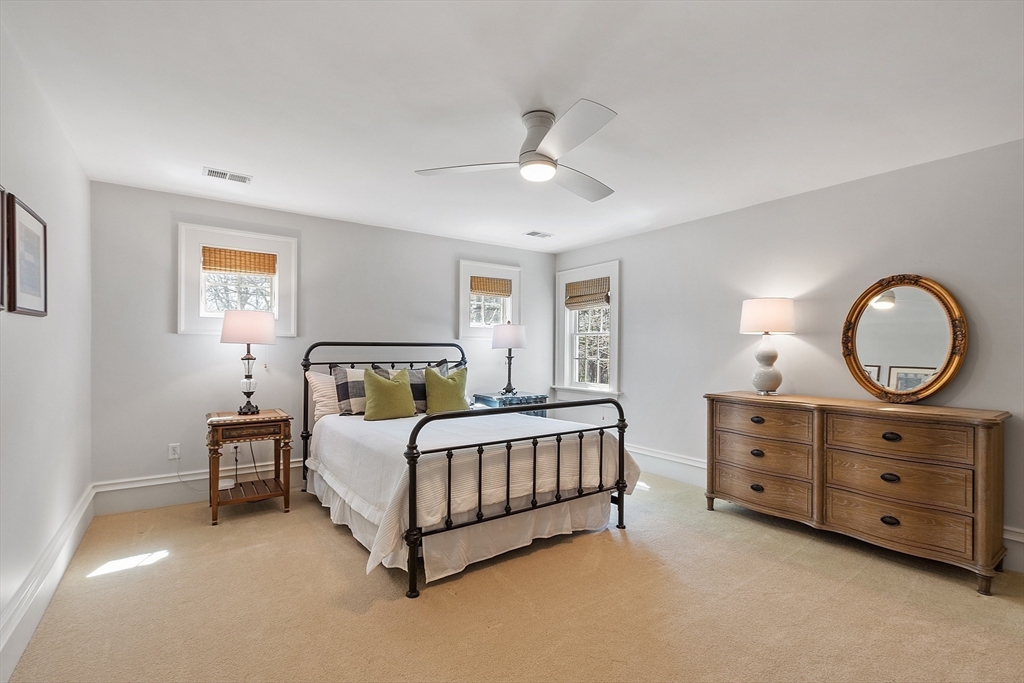 287 Westford Road Concord, MA 01742 - Photo 34 of 42 a spacious bedroom with a bed and a dresser