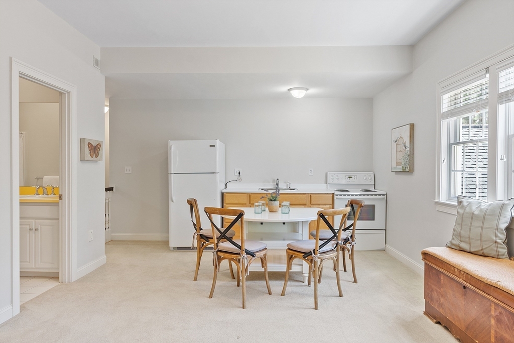 287 Westford Road Concord, MA 01742 - Photo 37 of 42 a view of a dining room with furniture and a window