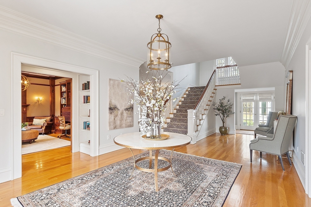 287 Westford Road Concord, MA 01742 - Photo 5 of 42 a living room with dining table and a chandelier