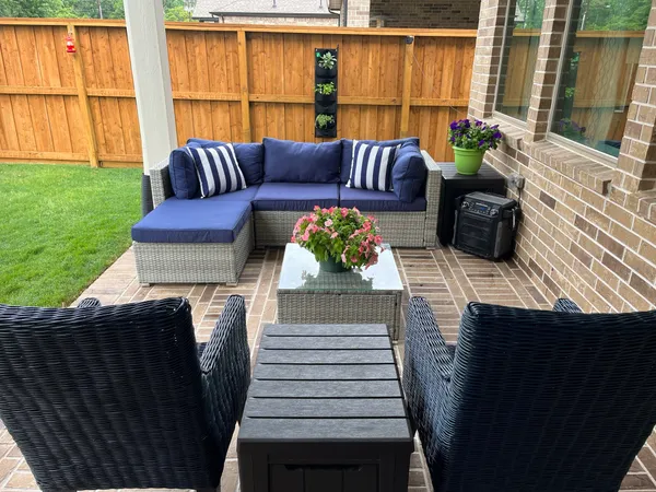 a balcony with furniture and a window