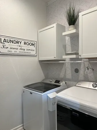 a utility room with washer and dryer
