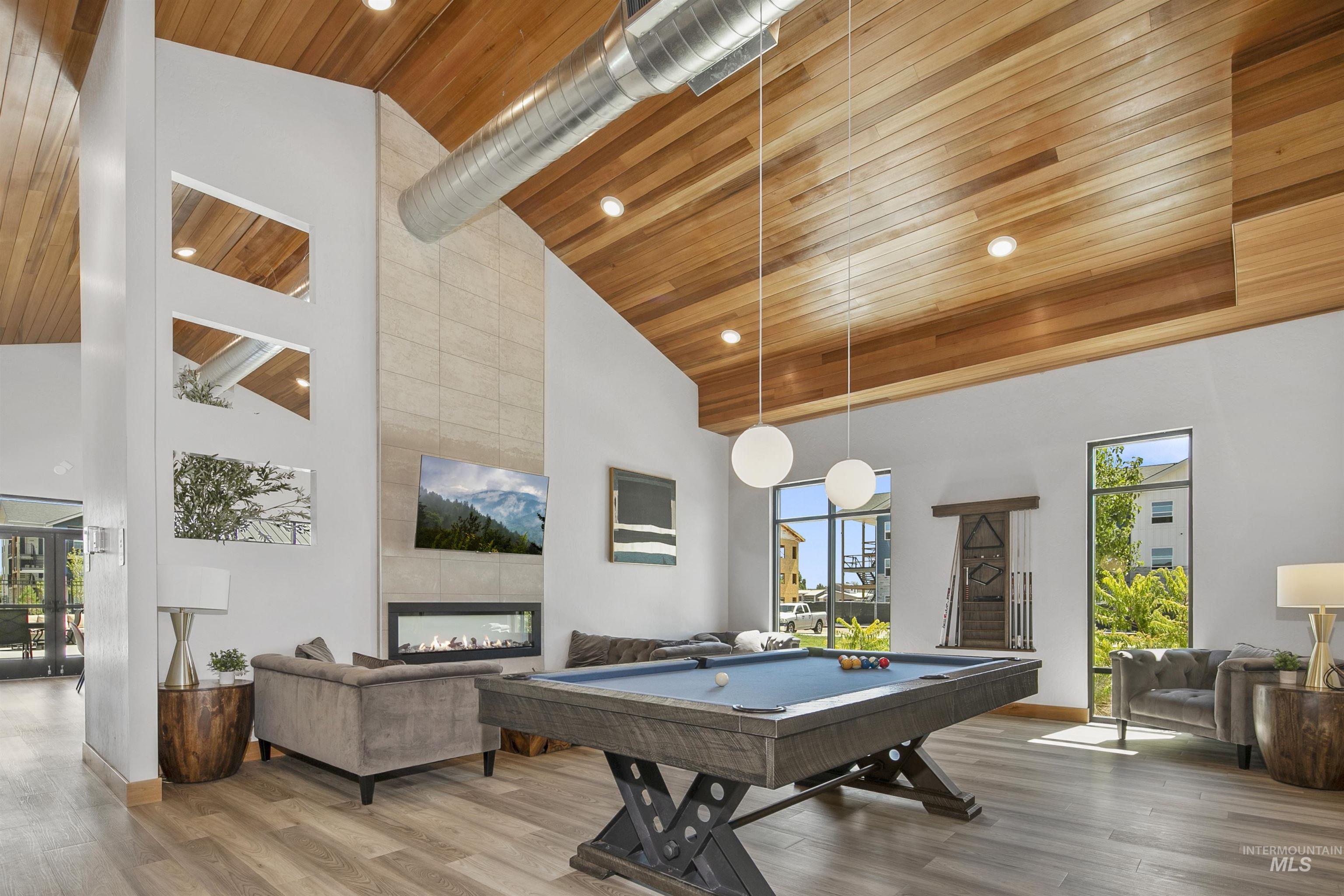 683 West Wrangler Street Meridian, ID 83646 - Photo 5 of 11 Playroom featuring wooden ceiling, a tiled fireplace, high vaulted ceiling, pool table, and wood finished floors
