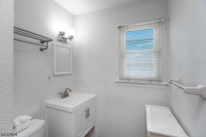 504 Nottingham Way, Unit 504 Flemington, NJ 08822 - Photo 6 of 12 a bathroom with a sink toilet and vanity
