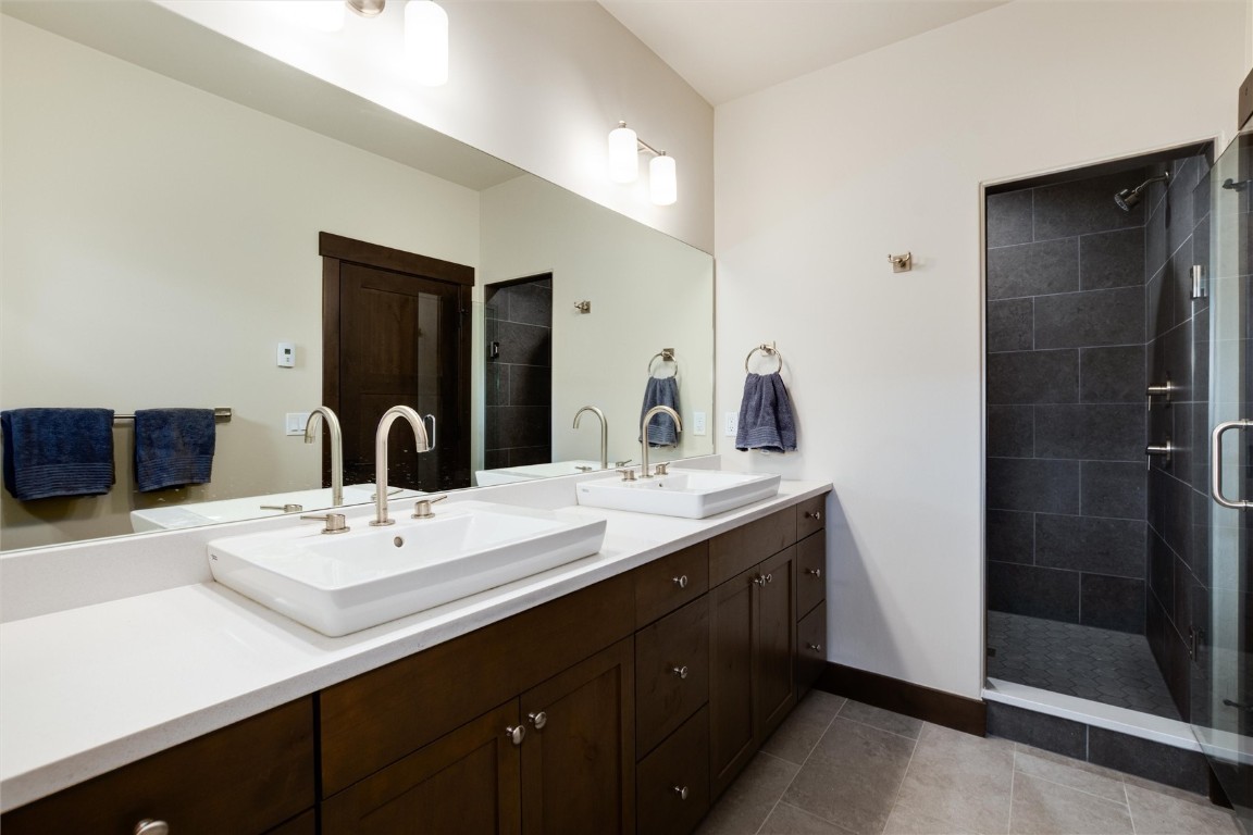 17 Vendette Road Silverthorne, CO 80498 - Photo 24 of 50 a bathroom with a double vanity sink and a mirror