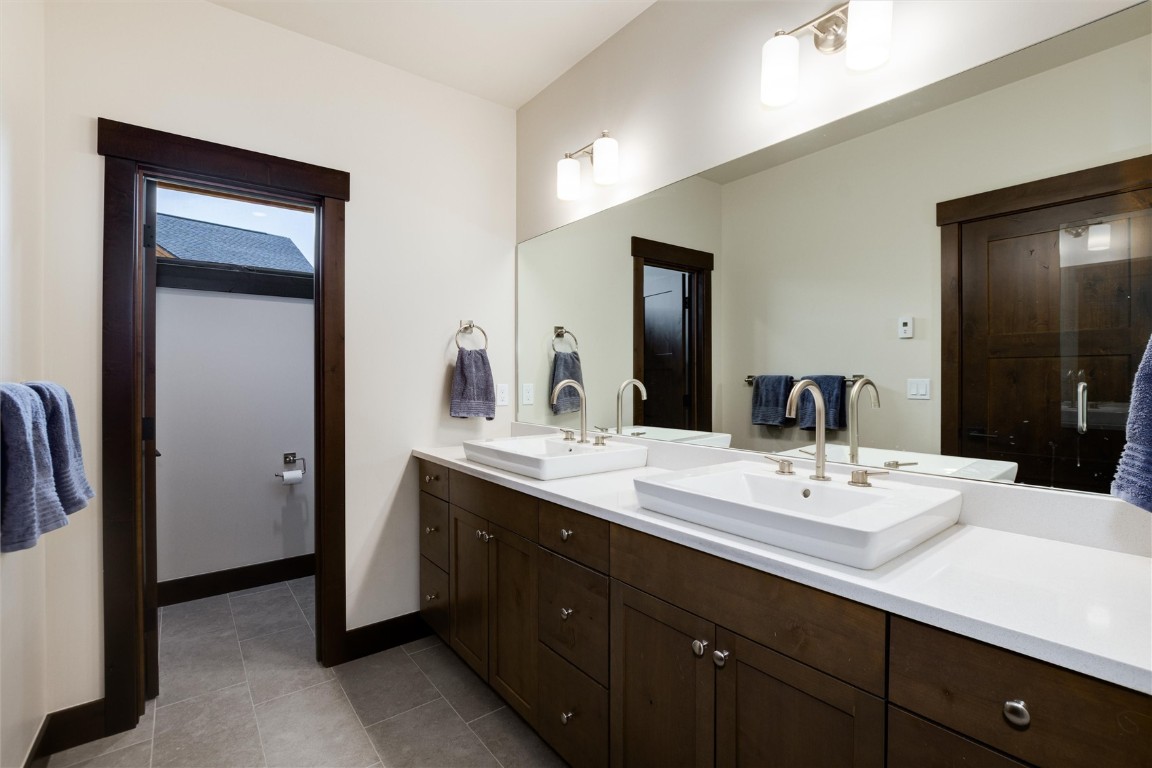 17 Vendette Road Silverthorne, CO 80498 - Photo 25 of 50 a bathroom with a double vanity sink and a mirror