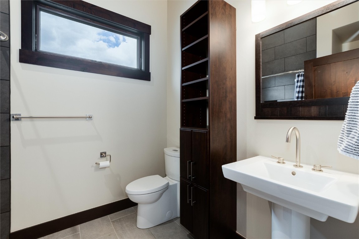 17 Vendette Road Silverthorne, CO 80498 - Photo 27 of 50 a bathroom with a toilet sink and mirror