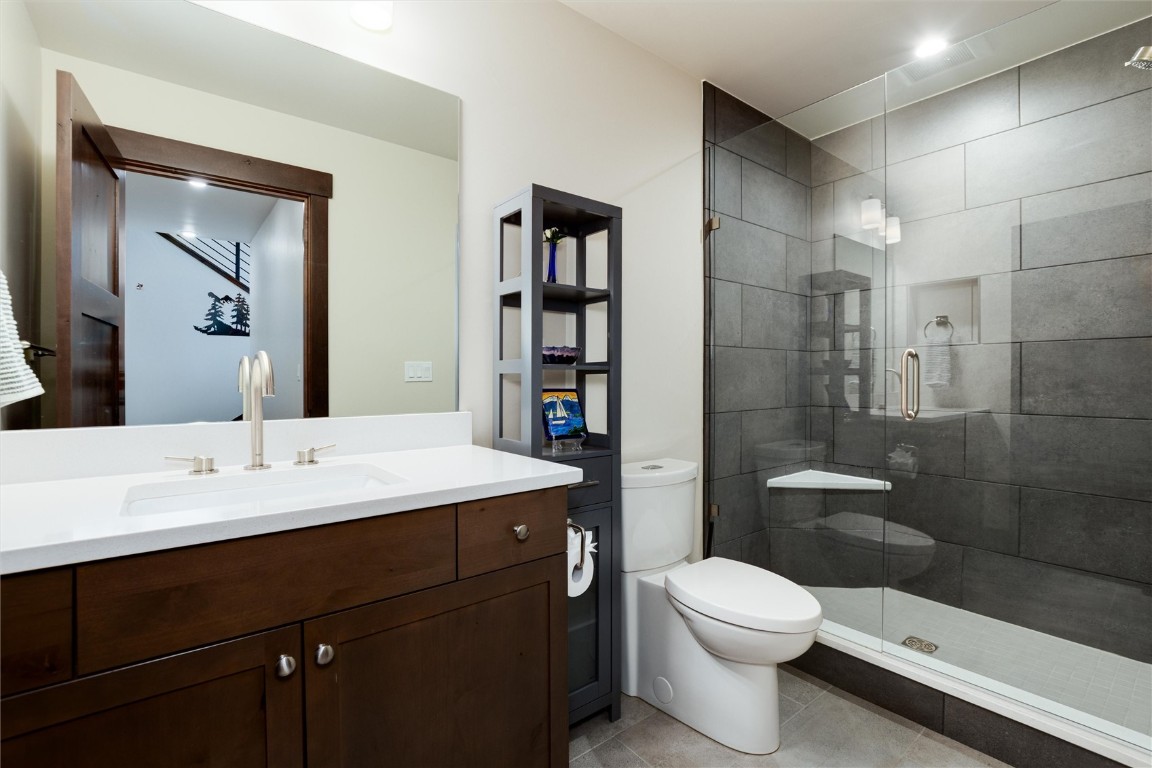 17 Vendette Road Silverthorne, CO 80498 - Photo 31 of 50 a bathroom with a sink a toilet and shower