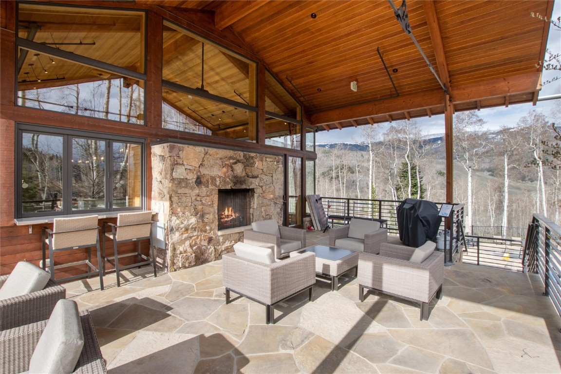 17 Vendette Road Silverthorne, CO 80498 - Photo 40 of 50 a outdoor living space with patio furniture and a fireplace