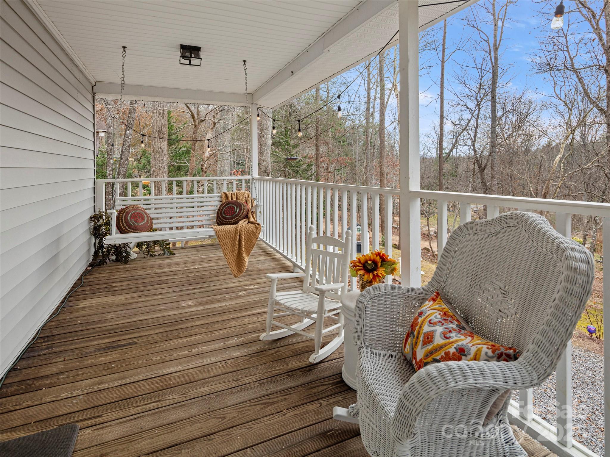 33 Ivy Cove Road Fairview, NC 28730 - Photo 19 of 36 a balcony with furniture and wooden floor