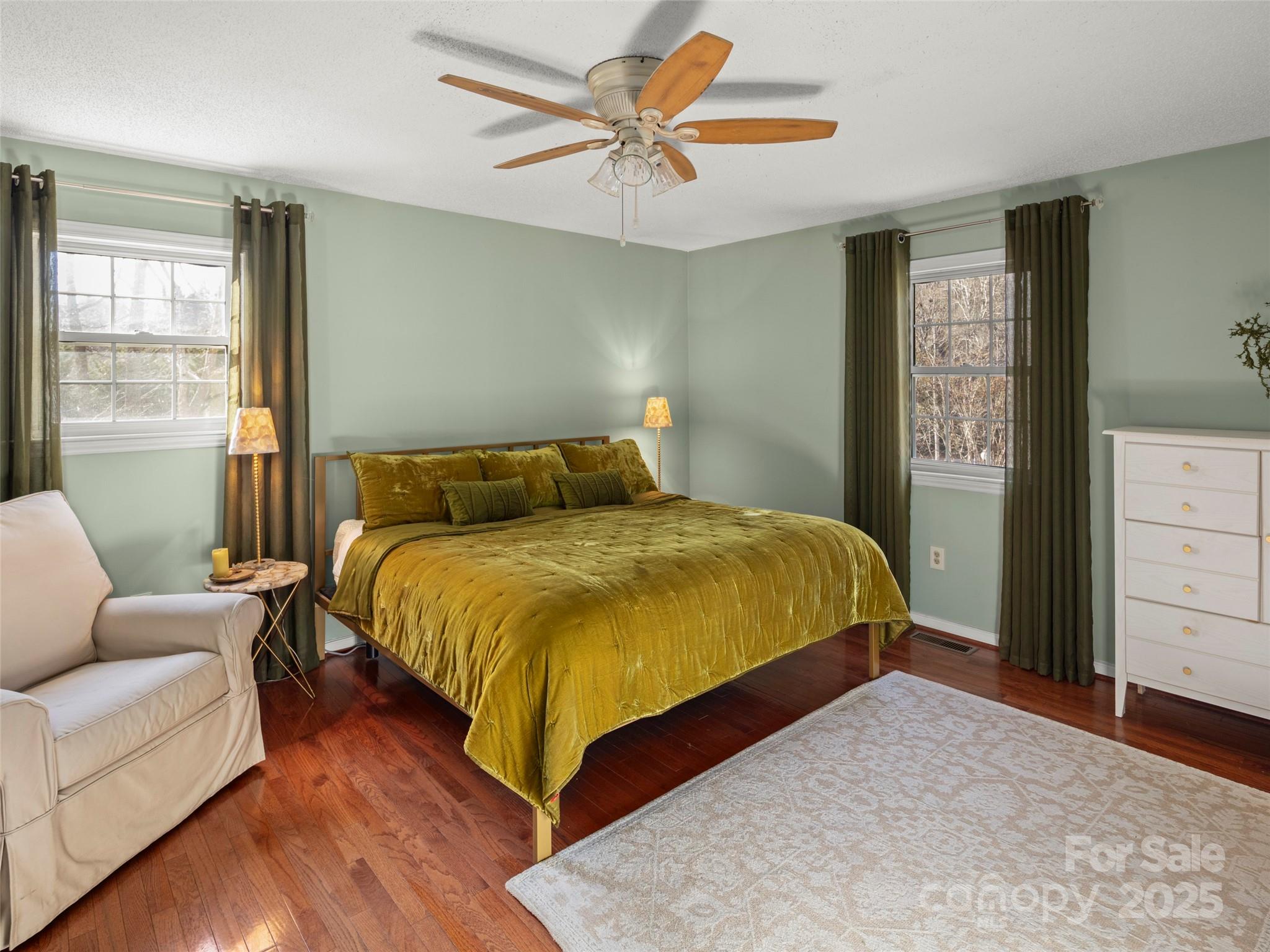 33 Ivy Cove Road Fairview, NC 28730 - Photo 22 of 36 a bedroom with a bed a couch and a dresser