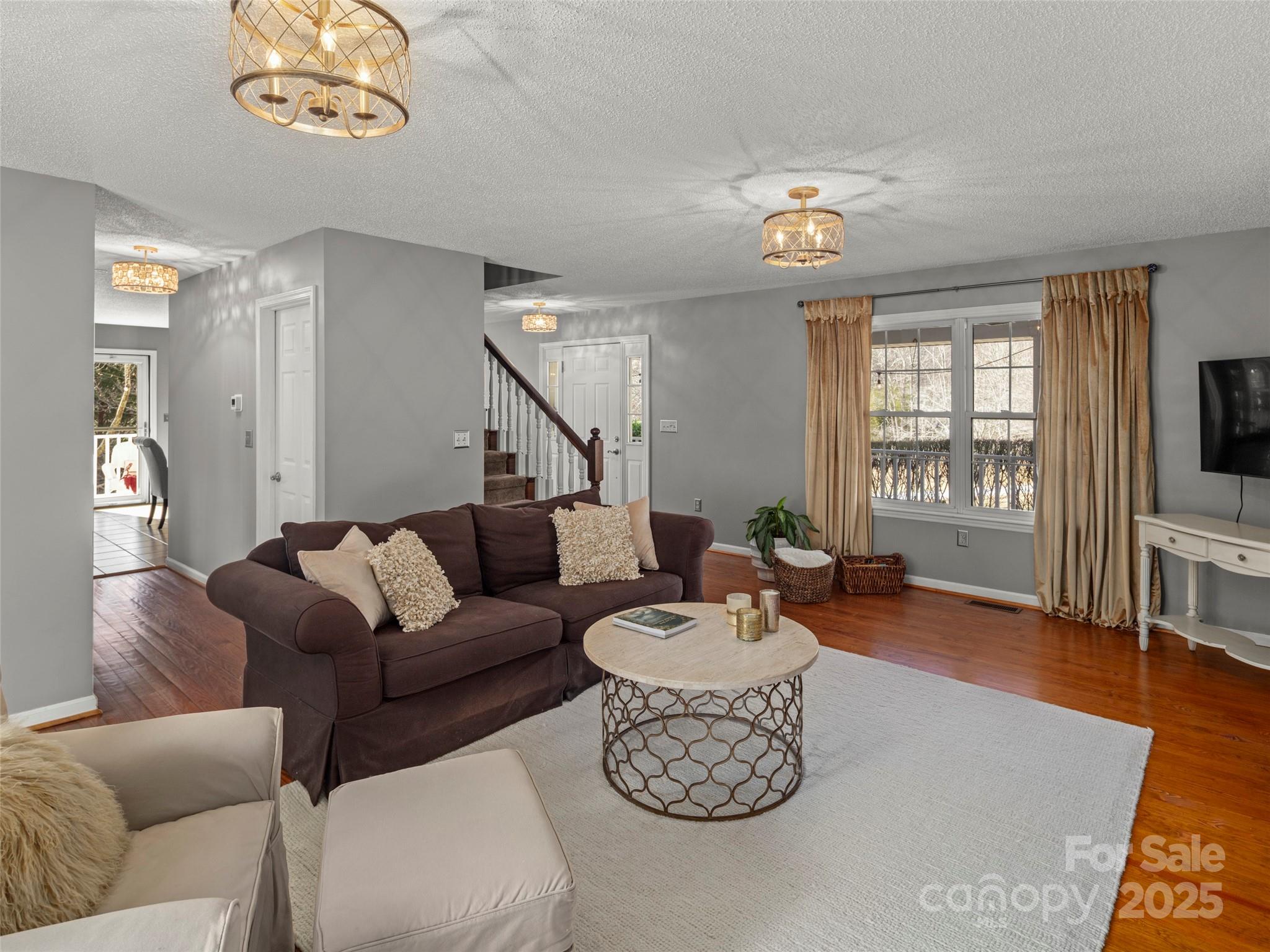 33 Ivy Cove Road Fairview, NC 28730 - Photo 9 of 36 a living room with furniture and a flat screen tv