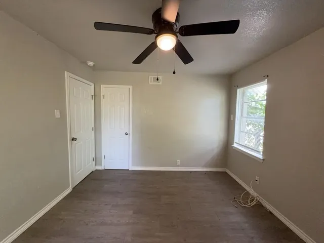 a view of an empty room and window