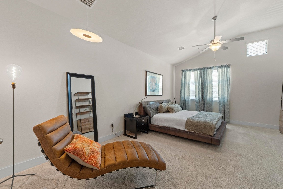 7407 Merrick Lane Austin, TX 78745 - Photo 14 of 34 a bedroom with bed and window