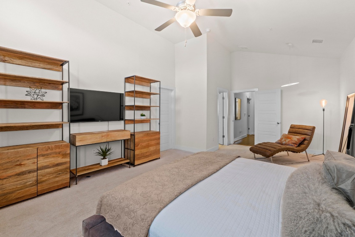 7407 Merrick Lane Austin, TX 78745 - Photo 17 of 34 a bedroom with a bed and furniture