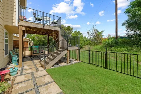 a view of a roof deck with couches and wooden floor