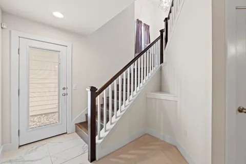 a view of a hallway with windows
