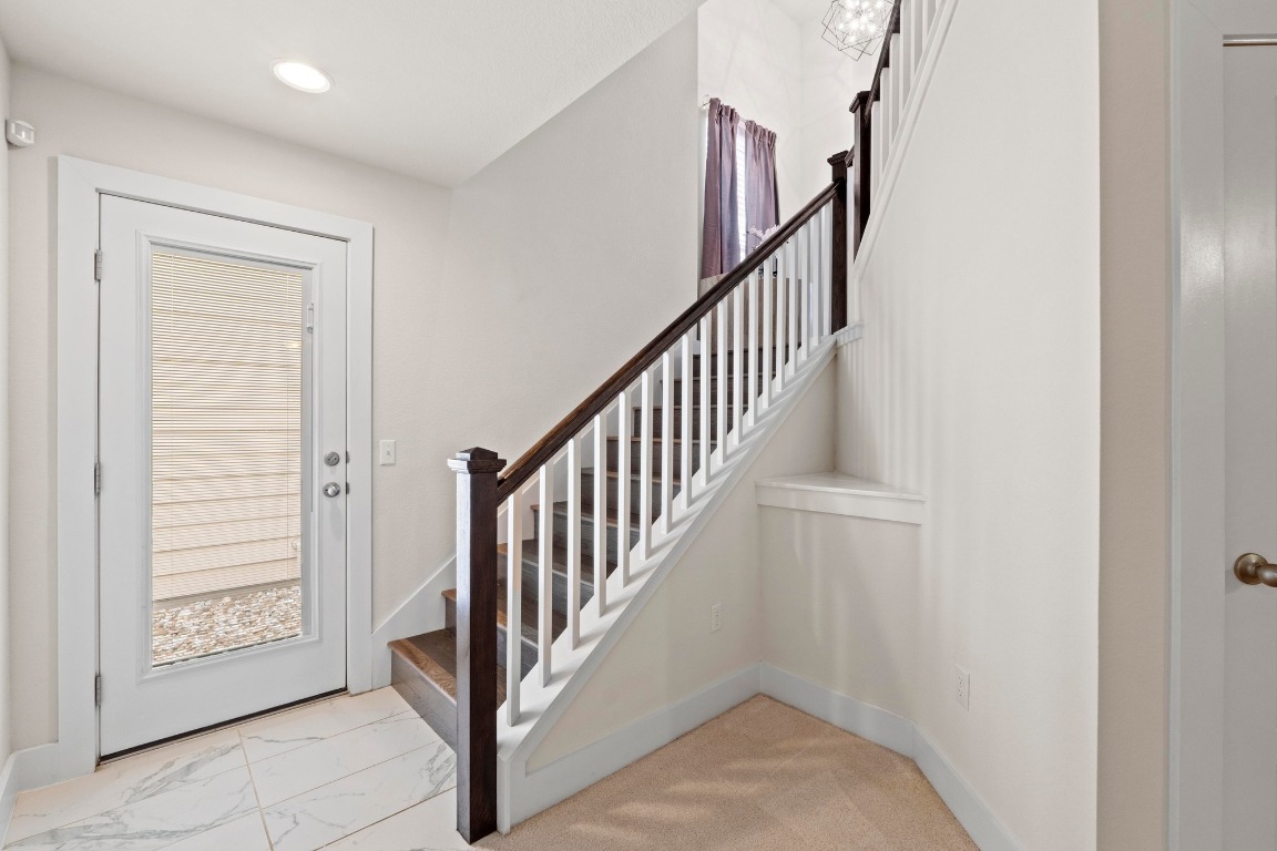 7407 Merrick Lane Austin, TX 78745 - Photo 21 of 34 a view of a hallway with windows