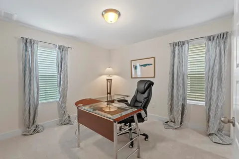 a work room with furniture and a window