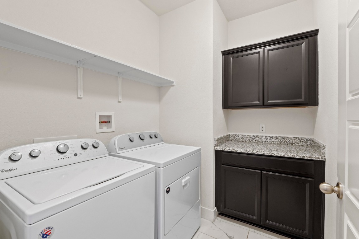 7407 Merrick Lane Austin, TX 78745 - Photo 29 of 34 a utility room with dryer and washer