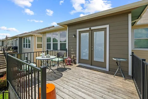 a balcony view with a seating space