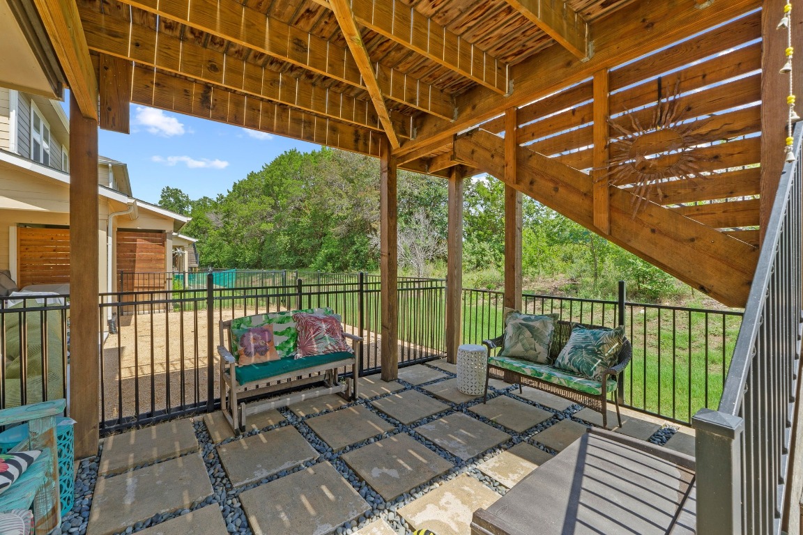 7407 Merrick Lane Austin, TX 78745 - Photo 31 of 34 a view of a balcony with wooden floor and outdoor seating