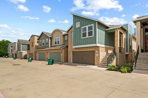 a view of a house next to a yard