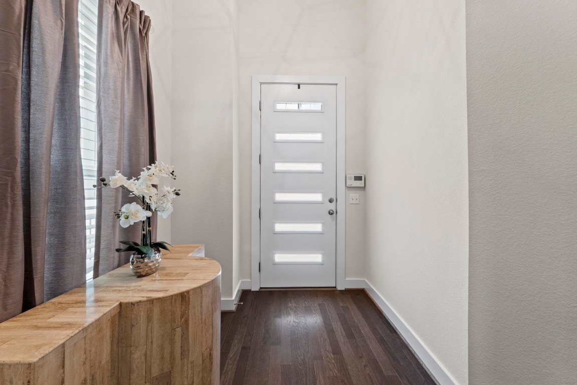 7407 Merrick Lane Austin, TX 78745 - Photo 4 of 34 a bathroom with a sink a mirror and a shower
