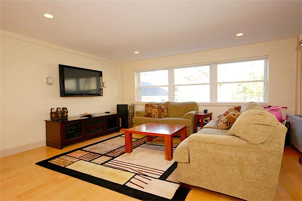 1600 Beacon Street, Unit 401 Brookline, MA 02446 - Photo 5 of 22 a living room with furniture a flat screen tv and a large window