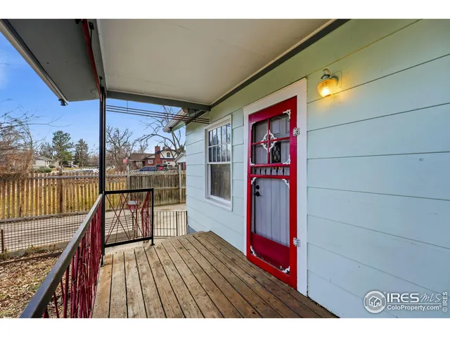a view of balcony with wooden floor and outdoor seating