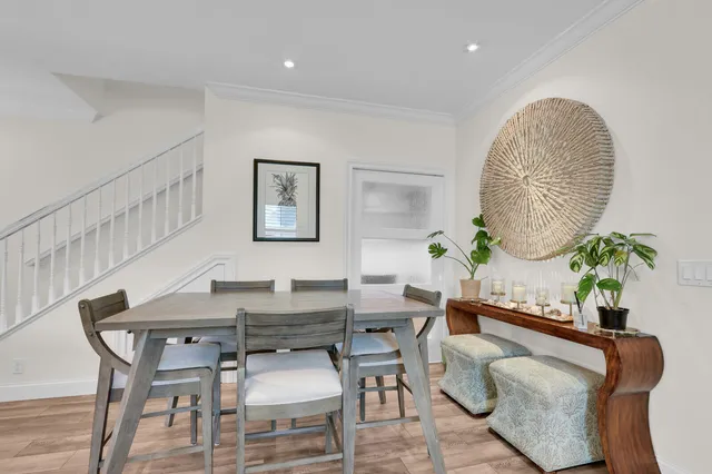 a living room with furniture a table and a potted plant