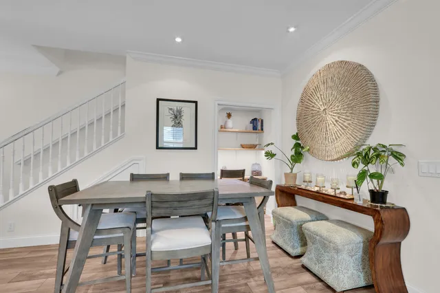 a living room with furniture a table and a potted plant