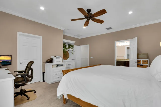 a bed room with a bed and a desk