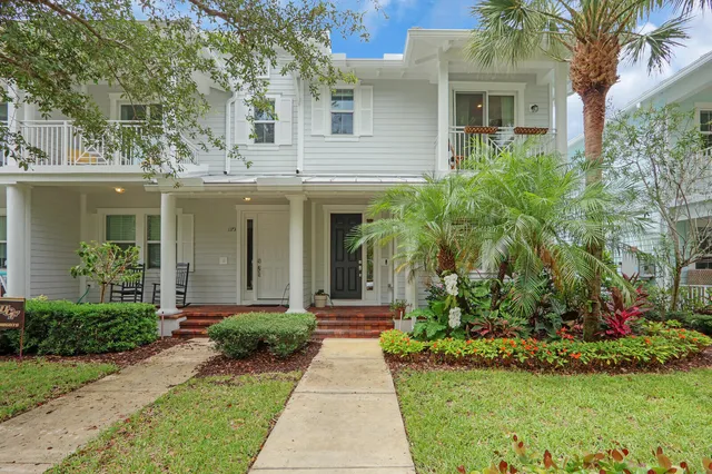 front view of a house next to a yard