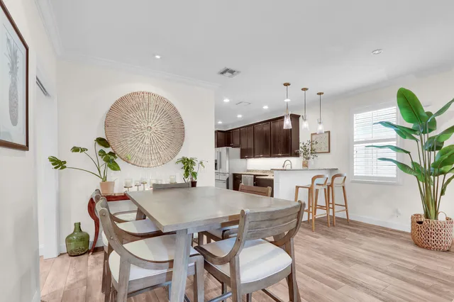 a view of a dining room with furniture window and wooden floor