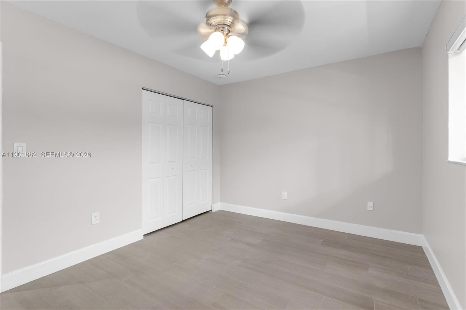 8045 Southwest 107th Avenue, Unit 303 Miami, FL 33173 - Photo 13 of 37 wooden floor in an empty room